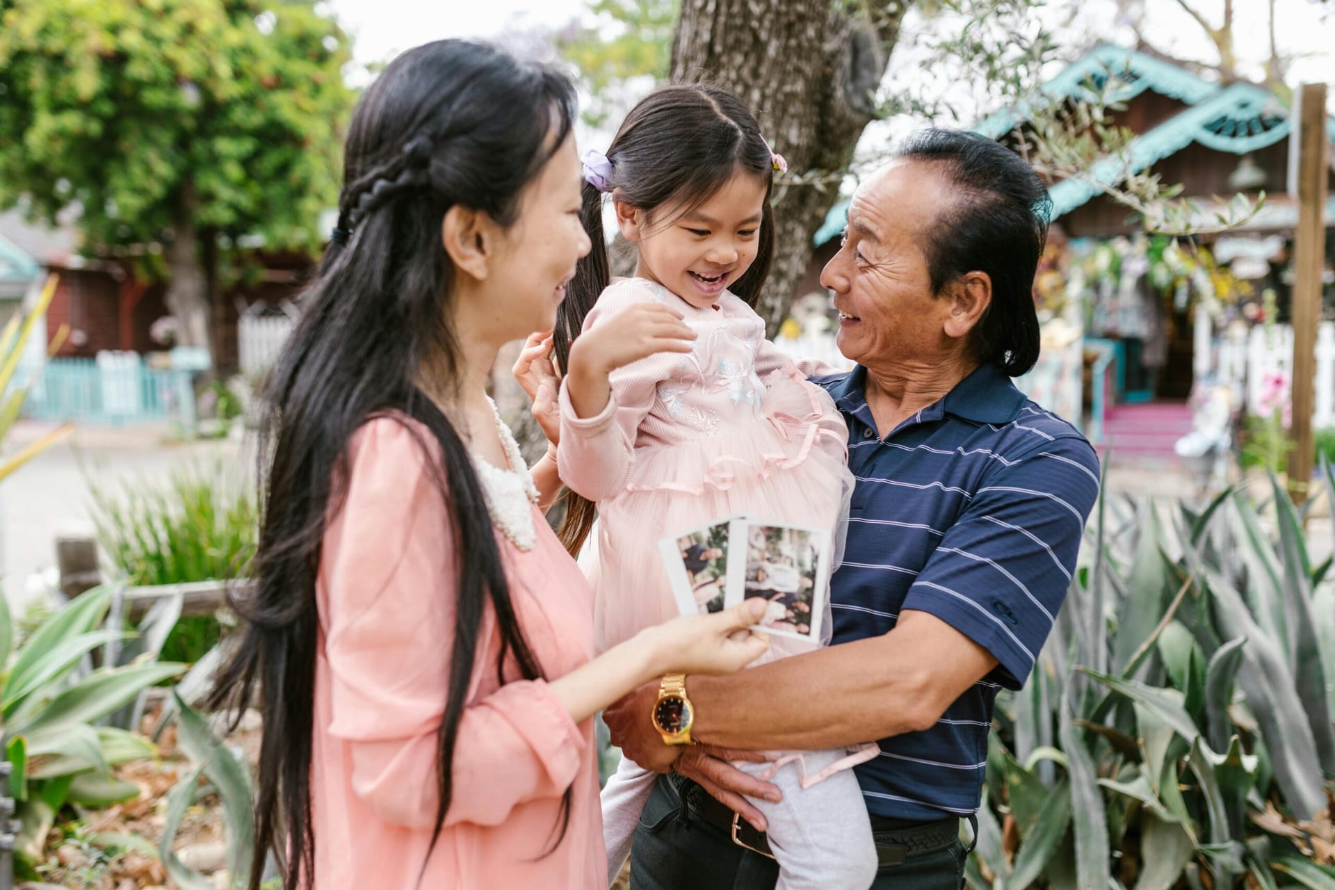 Grandpa and Mom holding daughter